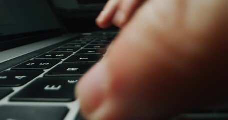 Alternative macro close up of an young businessman hands busy working on laptop or computer keyboard for send emails and surf on a web browser.