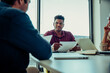 © Prins Productions - Business man discussing paper work listening to boss sitting in conference room during team meting