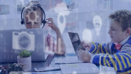 Poster - Digital icons floating against girl and boy using laptop and digital tablet