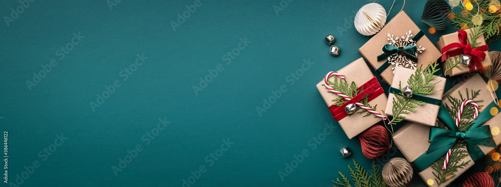 Banner with many gift boxes tied velvet ribbons and paper decorations on turquoise background. Christmas background. - obrazy, fototapety, plakaty 