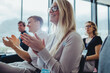 © Jacob Lund - Group of business people clapping hands at seminar