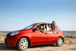 © New Africa - Happy family in car near sea. Summer trip