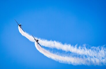 two jets with contrails in airshow