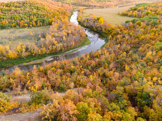 Aerial View of Winding River with Colorful Autumn Trees in Rural North Dakota.