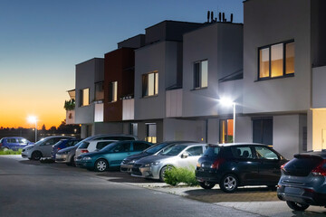 Canvas Print - modern street with apartment building and led street lights