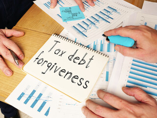 Wall Mural - Tax debt forgiveness is shown on the conceptual business photo