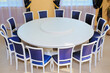 Empty white round conference table and chairs. Diplomatic background.
