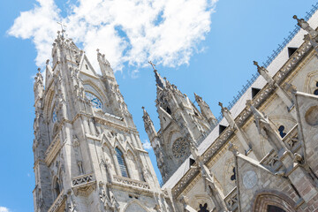 The famous gothic cathedral of Quito, Ecuador. Blue sky and white clouds in the background