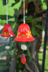 Wall Mural - Red ceramic bells hanging on a string