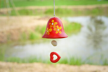 Wall Mural - red ceramic bells hanging on a string