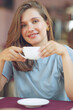 © nuzza11 - Thoughtful mature woman sits in a cafeteria holding a coffee mug. A middle-aged woman drinks tea while thinking. Relaxing and thinking while drinking coffee. High quality photo.