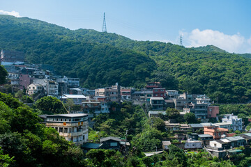 Sticker - landscape view of JiuFen Village with mountain residental buildings and blue sky.