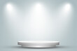 Empty space of Round white podium or pedestal in studio room with spotlight in gray background.