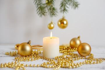 Christmas background, Golden Christmas toys , beads and a burning candle. Greeting card with Christmas