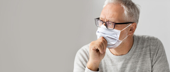 Sticker - old age, problem and people concept - close up of senior man in glasses wearing face protective medical mask for protection from virus disease over grey background