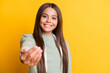 © deagreez - Photo of adorable charming child girl dressed casual green outfit inviting you come isolated yellow color background