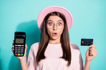 Poster - Close-up portrait of her she nice attractive amazed wondered girl client holding in hands atm card reader bonus cash back service isolated bright vivid shine vibrant green turquoise color background