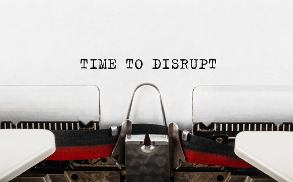 Text Time to Disrupt typed on retro typewriter