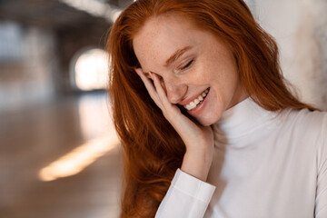 Close-up of a young woman with ginger hair