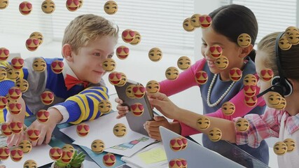 Poster - Multiple face emojis floating against group of kids using digital tablet
