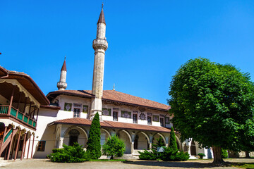 Canvas Print - Building of Big Khan Mosque in Bakhchisaray, Crimea. It was founded in XVI century. Now it's one of few existant monuments of old Crimean Tatar architecture. Writings on wall are suras from Koran