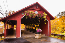 Beautiful Vermont Covered Bridge Surrounded By Colorful Fall Foliage.