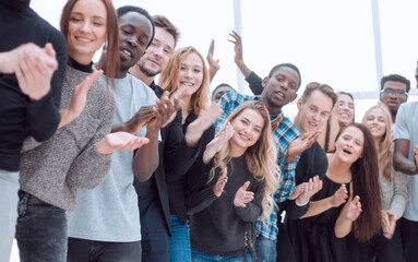 Wall Mural - group of diverse young people are applauding while looking at you