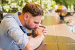 © palidachan - Christian man praying to God for his blessing.