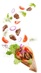 Doner kebab or shawarma with ingredients floating in the air : beef meat, lettuce, onion, tomatos, spice. White background. Copy space.