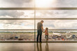 © Dawid - Silhouette of family, father and daughter on airport terminal. Holding hands and looking at each other, waiting for departure. Dublin, Ireland