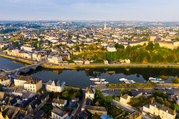 Wall Mural - View from drone of houses and Mayenne river at Chateau-Gontier town at sunny summer day, France