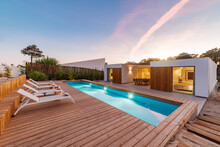 Modern House With Garden Swimming Pool And Wooden Deck