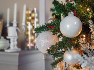 ..Close up decoration hanging on Christmas tree branches. glass Christmas ball. vintage. golden baubles. bokeh. garland in the background