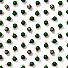 Seamless Regular Creative Pattern With Bright Shiny Little Green Christmas Balls Isolated On White Background. Printing On Fabric, Wrapping Paper.