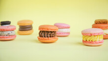 Assortment Colorful  Korean Macaroons On Yellow Background