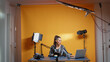 © DC Studio - Influencer in her professional studio recording a new episode for subscribers. Backstage of content creator new media star on social media for internet web online audience podcast episode microphone