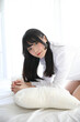 © Oran Tantapakul - Portrait beautiful asian girl sleeping on bed in white room