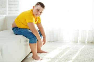 A boy with metabolic disorders. Child with the problem of childhood obesity. Overweight obese fat boy. High quality photo.