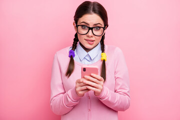 Poster - Close-up portrait of her she attractive pretty lovely cute unsure shy brown-haired girl geek using digital device 5g app choosing buying goods service biting lip isolated pink pastel color background