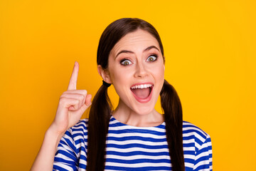 Canvas Print - Close-up portrait of her she nice attractive pretty lovely glad intellectual cheerful cheery brown-haired schoolgirl learning pointing up isolated on bright vivid shine vibrant yellow color background