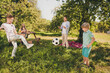 © deagreez - Portrait of nice attractive adorable cheerful full big family small little brother sister spending sunny day weekend playing soccer pastime fresh air activity in green park village backyard