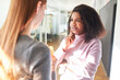 © Robert Kneschke - African business woman listens critically