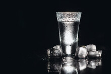 Vodka In Shot Glasses On Black Background, Iced Strong Drink In Misted Glass
