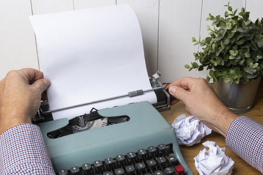 write with an old typewriter on a wooden  table