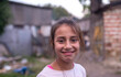 A portrait of a beautiful little gypsy girl on the street