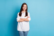 Photo of charming lady arms crossed beaming smile top manager wear white shirt jeans isolated blue color background