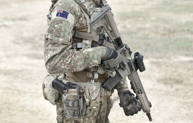 Wall Mural - Soldier with assault rifle and flag of Australia on military uniform. Collage.