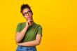 © Prostock-studio - Black woman in glasses thinking about question, touching chin