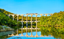 Regional Train On The Cize-Bolozon Viaduct Across The Ain Gorge In France