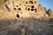 Cave Houses Carved In Stone At Cappadocia, Turkey. Ancient Cave Dwellings. Unique Rock Formations.